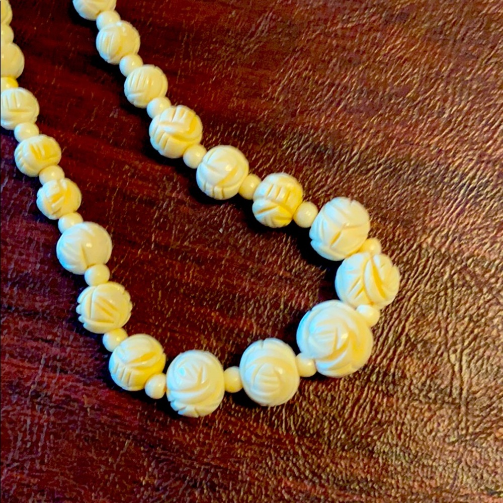 Carved bone rose necklace